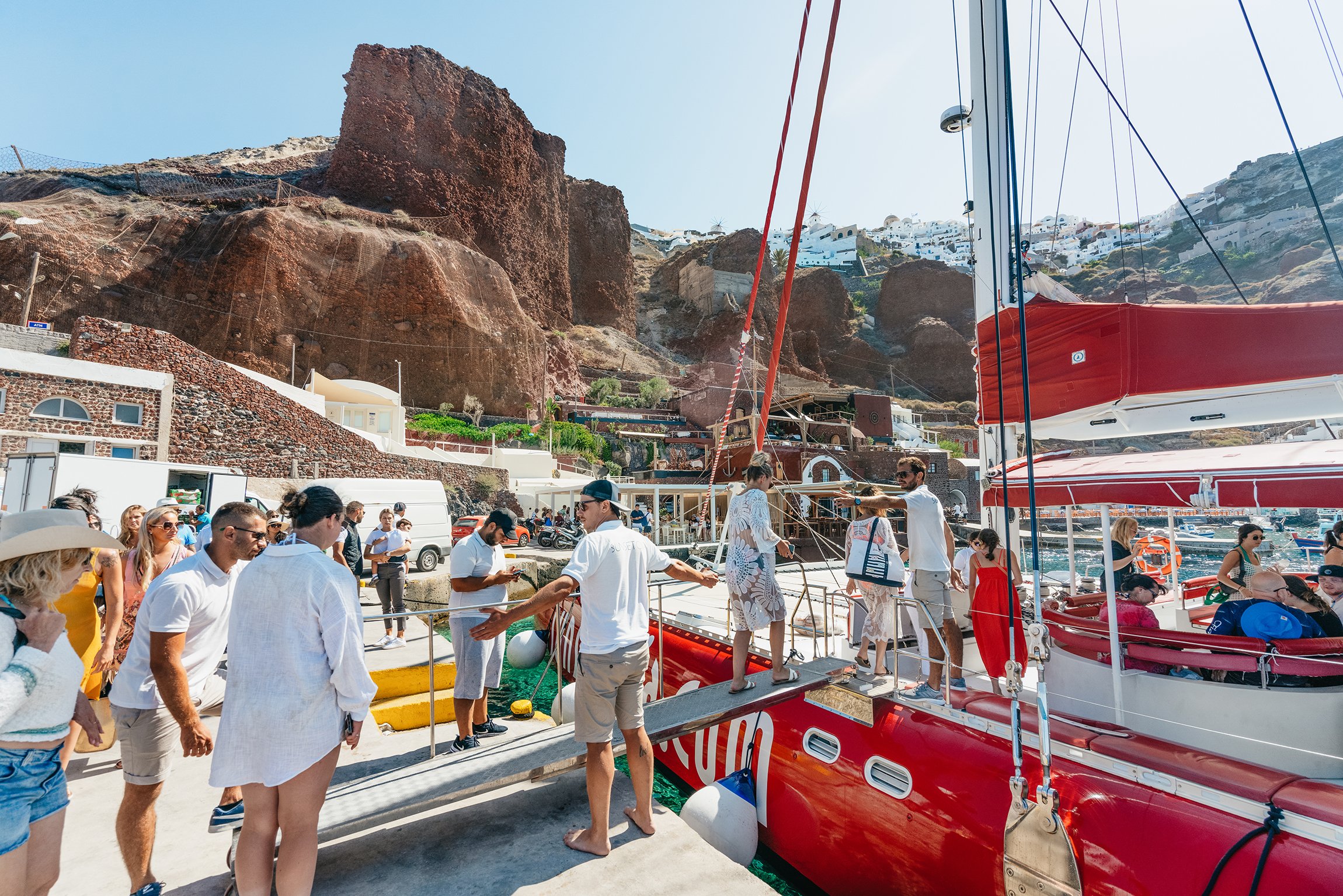 Santorini: Catamaran Tour with BBQ Dinner, Drinks, and Music